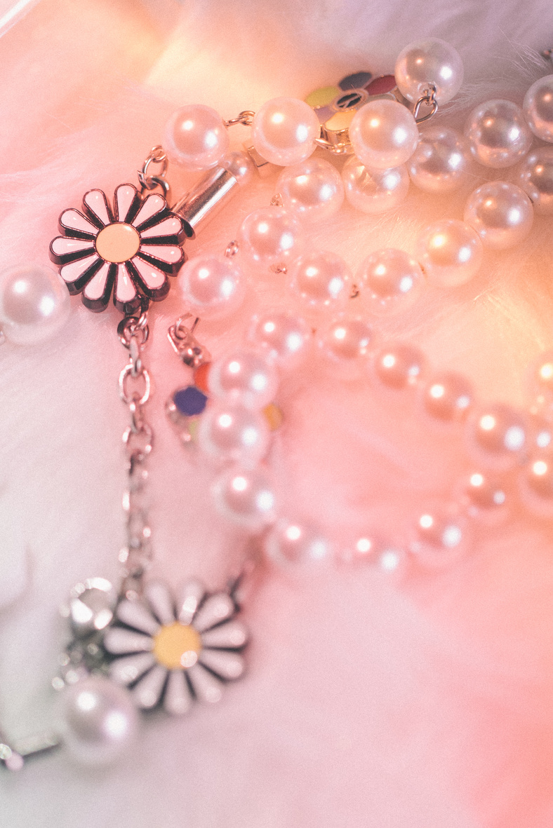 Pearl and Chain Necklace on Light Background